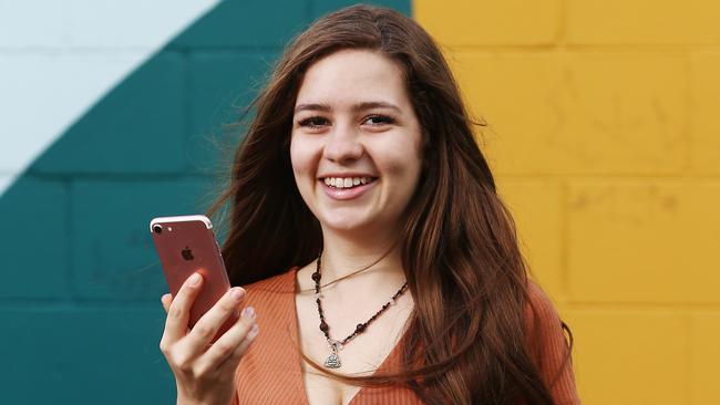 Australia's largest mobile phone network Telstra is changing its plans with an aim to attract new customers and to entice current customers to upgrade their phones. Kirra Watson, 19, of Kewarra Beach, is upgrading her current Telstra plan with a new one. PICTURE: BRENDAN RADKE