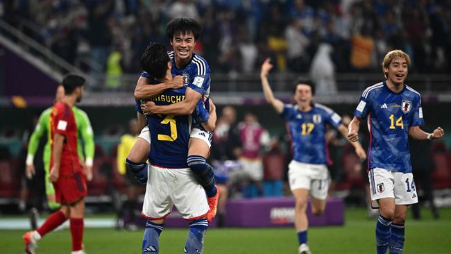 Japan's players react after the Qatar 2022 World Cup Group E football match between Japan and Spain. (Photo by Anne-Christine POUJOULAT / AFP)