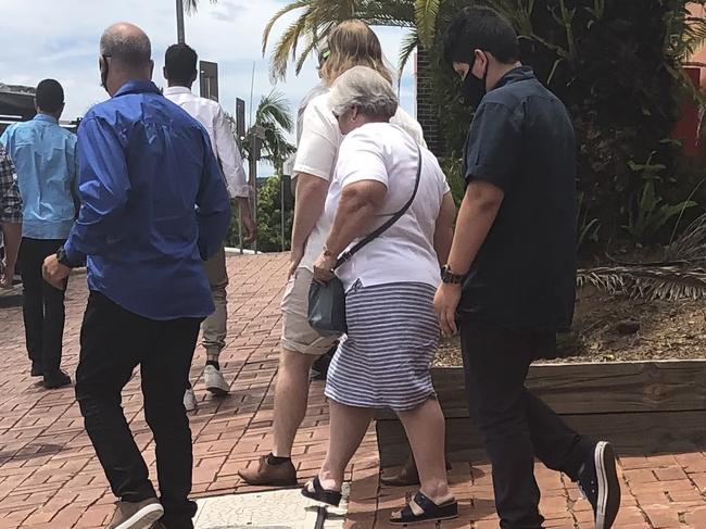 Brendan Piccini (black shirt) leaving Lismore District Court with a large group of supporters.