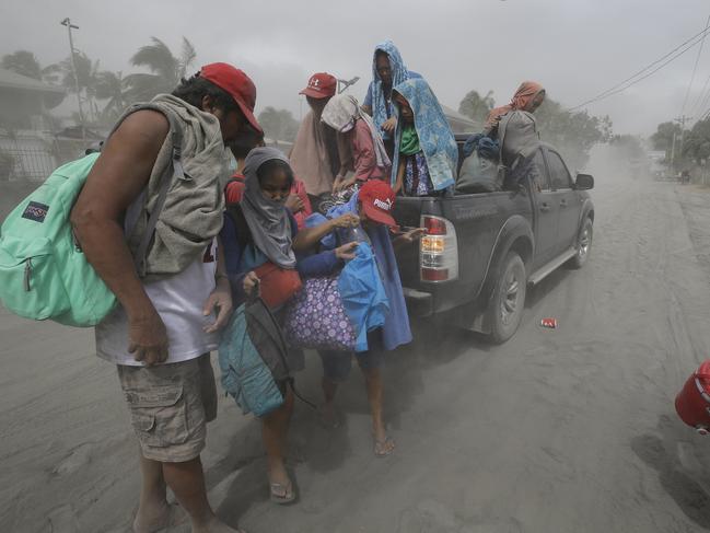 A family evacuates. Picture: AP