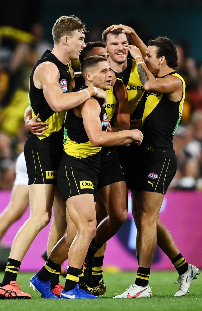 Dion Prestia celebrates with his teammates after scoring the first goal. Picture: Getty