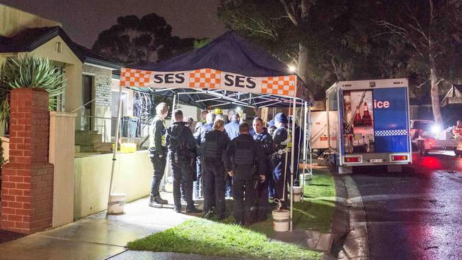 Police at the scene of the fatal dog attack on the Wednesday night. Picture: Jake Nowakowski