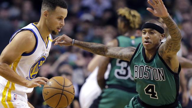 Golden State Warriors guard Stephen Curry drives against Boston Celtics guard Isaiah Thomas.