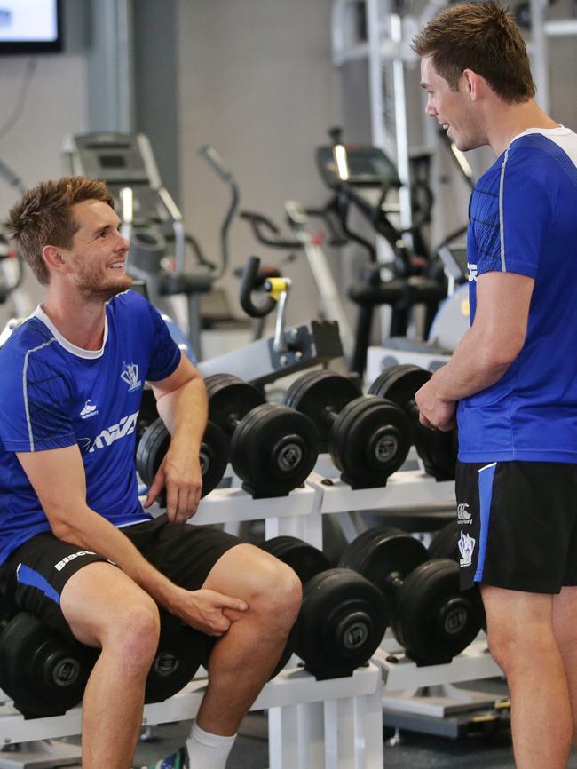 Brad McKenzie and Ryan Bastinac in the gym at North Melbourne. Picture: Hamish Blair