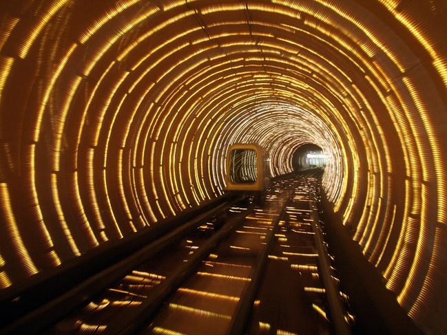 An empty tourist subway car runs through illuminated tunnel Thursday, Dec. 22, 2005 in Shanghai, China. China said Tuesday, Dec. 20 its economy is much bigger and less export-dependent than previously reported, issuing new data that analysts said may ease fears its roaring growth is unsustainable, and encourage even more foreign investment. (AP Photo/Eugene Hoshiko)