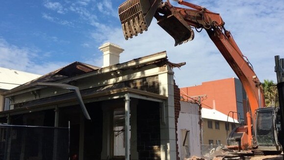 One of the two bluestone cottages being demolished in August 2016. Picture: Sandy Wilkinson