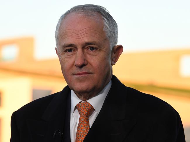 Australian Prime Minister Malcolm Turnbull waits to speak on morning TV interviews outside Parliament House in Canberra, Wednesday, May 10, 2017. Treasurer Morrison yesterday delivered his second budget. (AAP Image/Lukas Coch) NO ARCHIVING