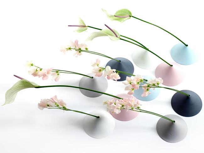 Clever ... Mini porcelain vases designed to hold a single flower up to 1m long.