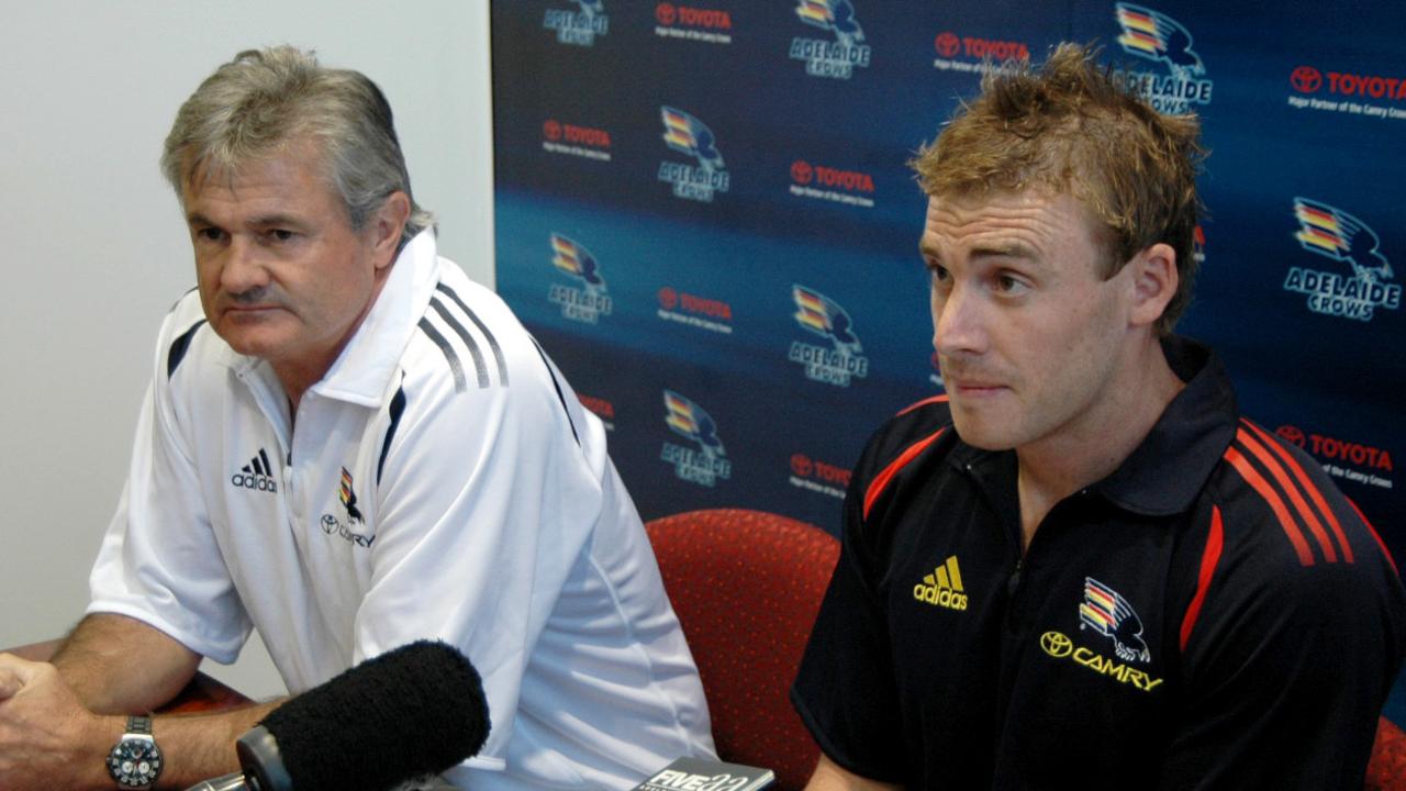 Goodwin (right), with then Crows coach Neil Craig, speaks to the media after being caught up in a betting scandal which saw him eventually fined $40,000.