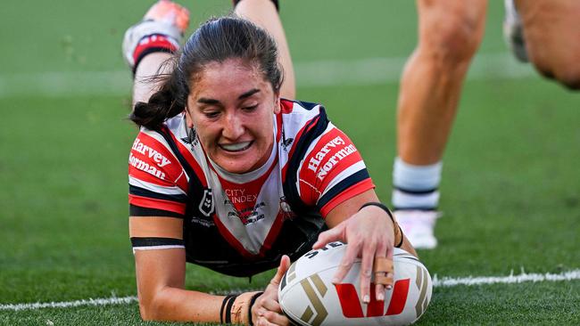 Sydney Roosters' Olivia Kernick scores a try during the National Rugby League (NRL) Women's Grand Final match between Sydney Roosters and Cronulla Sharks at Accor Stadium in Sydney on October 6, 2024. (Photo by Izhar KHAN / AFP) / -- IMAGE RESTRICTED TO EDITORIAL USE - STRICTLY NO COMMERCIAL USE --