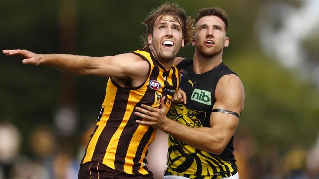 Hawk Max Lynch and Tiger Noah Balta compete in the ruck on Saturday. Picture: Dylan Burns/AFL Photos