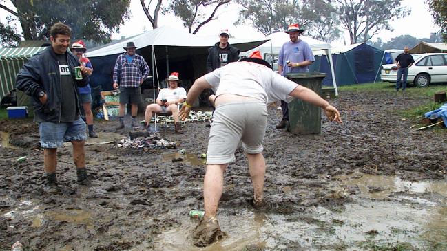 NOVEMBER 18, 2000 : Spectactors in ankle deep mud whilst camping at Mount Panaroma.