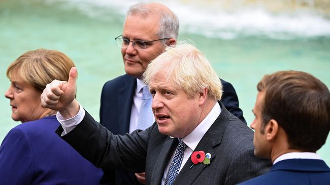 British Prime Minister Boris Johnson poses for a photo with Scott Morrison and Emmanuel Macron during the G20 leaders’ summit. Picture: Getty