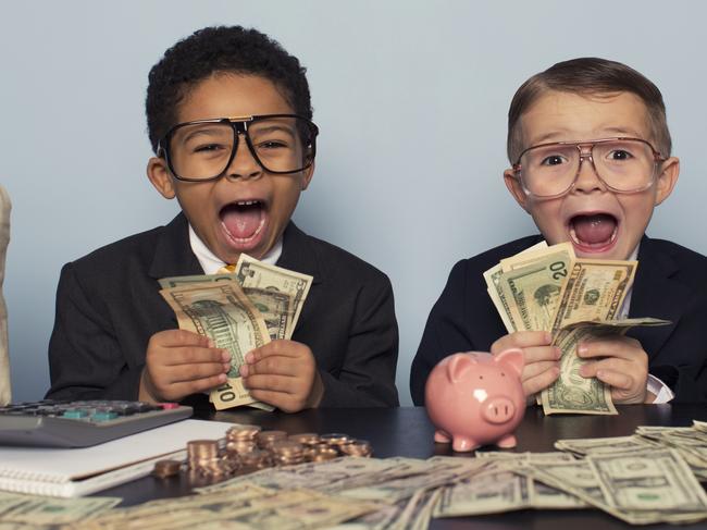 A couple of young boys with a mountain of cash. Picture: iStock