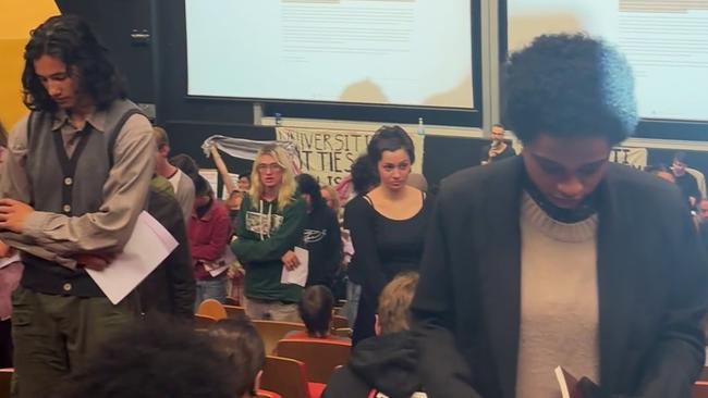 Anti-Israel students turn their backs on a Jewish speaker at the University of Sydney on Wednesday night.