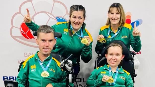 Back, (L-R) Ash Maddern and Amanda Leeson, front, Dan Michel, and Jamieson Leeson, winning their gold medals at the Boccia World Championships.