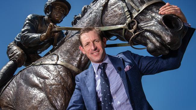 Hugh Bowman, with a statue of Winx, is looking forward to his return to The Valley. Picture: Tony Gough