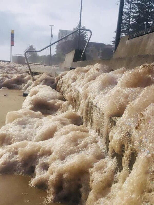 Foam has inundated Cronulla Beach.