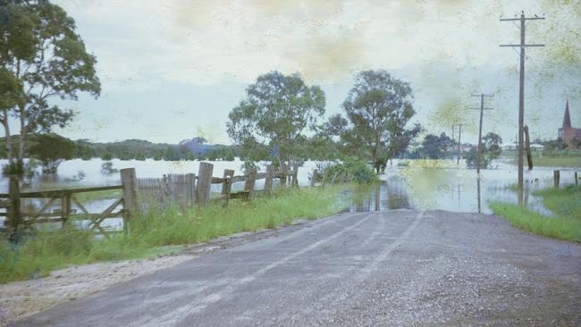 George Street during flood, 1971. A snapshot of the widespread flooding that affected daily life. Source: QLD Places