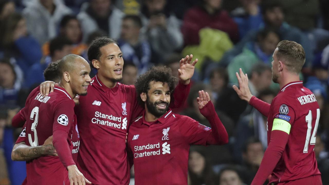 Liverpool's Virgil van Dijk celebrates with teammates after scoring his side's fourth goal