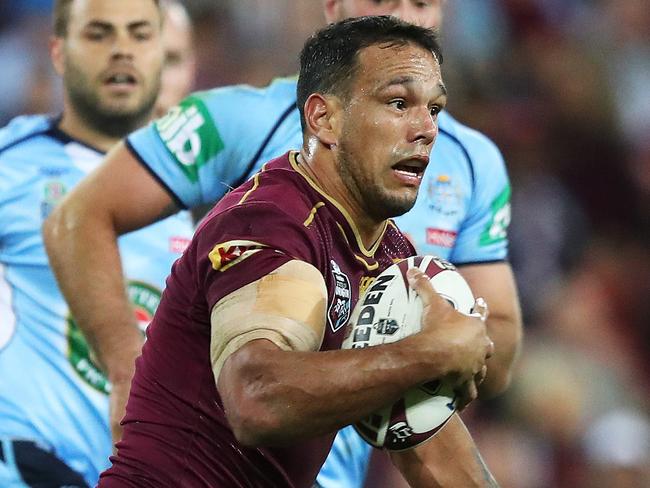 NSW's James Maloney tackles QLD's Will Chambers during the New South Wales Blues v Queensland Maroons State of Origin rugby league match at Suncorp Stadium, Brisbane. Picture: Brett Costello