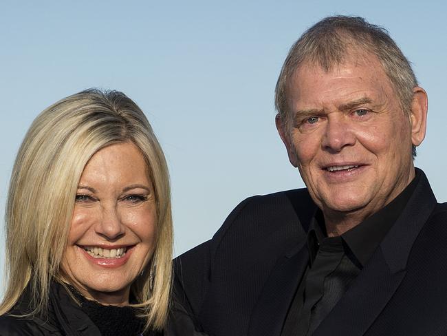 John Farnham and Olivia Newton-John pose for a portrait at Melbourne Docklands ahead of their Two Strong Hearts tour. Picture: Jake Nowakowski