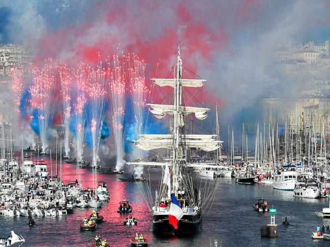 Fireworks herald the arrival of the French 19th-century three-masted barque, Belem, at Marseille’s Vieux-Port during the Olympic Flame welcome ceremony. Picture: Sylvain Thomas/AFP