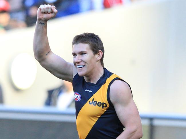 Matthew White celebrates a goal for Richmond in the round 15 AFL match between Richmond and Melbourne at the MCG in Melbourne, Saturday, July 7, 2012. (AAP Image/David Crosling) NO ARCHIVING, EDITORIAL USE ONLY