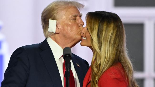 Former US President and 2024 Republican presidential candidate Donald Trump kisses former US First Lady Melania Trump onstage after he accepted his party's nomination on the last day of the 2024 Republican National Convention at the Fiserv Forum in Milwaukee, Wisconsin, on July 18, 2024. Days after he survived an assassination attempt Trump won formal nomination as the Republican presidential candidate and picked Ohio US Senator J.D. Vance for running mate. (Photo by ANDREW CABALLERO-REYNOLDS / AFP)