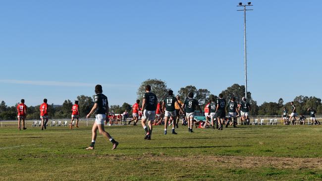 Spectators cheer on as they watch the B Grade St George vs Condamine match at the Roma Rugby Races at Bassett Park. Picture: Chloe Cufflin.