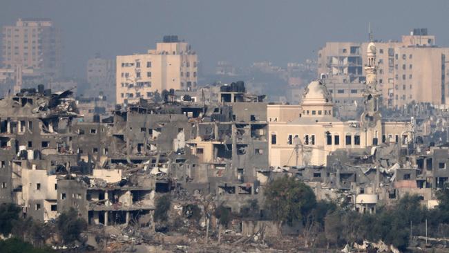 This picture taken from Israel's southern city of Sderot shows damaged buildings in the northern Gaza Strip on October 22 amid ongoing battles between Israel and Hamas. Picture: AFP