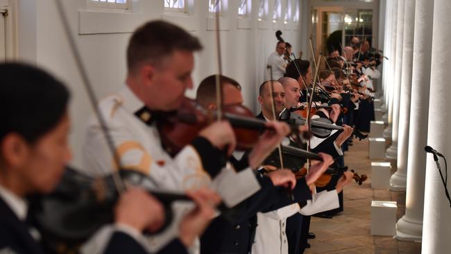 Violinists practice during for Saturday night’s big event. Picture: Mick Tsikas