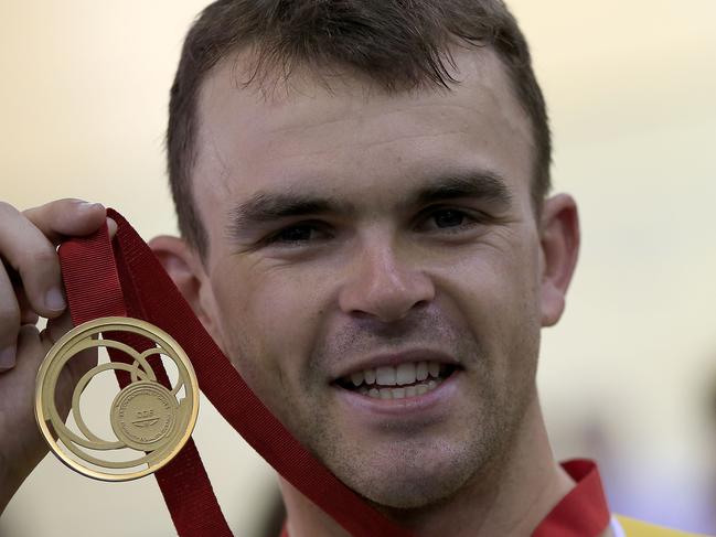 Australia's Jack Bobridge poses on the poidum after winning the gold medal in the men's 4000m individual pursuit race in the Sir Chris Hoy Velodrome during the 2014 Commonwealth Games in Glasgow, Scotland on July 25, 2014. AFP PHOTO/ADRIAN DENNIS