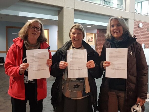 Three Knitting Nannas were charged with trespass after they blocked the Parliament House entryway by knitting "tell the truth" scarves during the Extinction Rebellion protests in October 2019. Picture: Extinction Rebellion