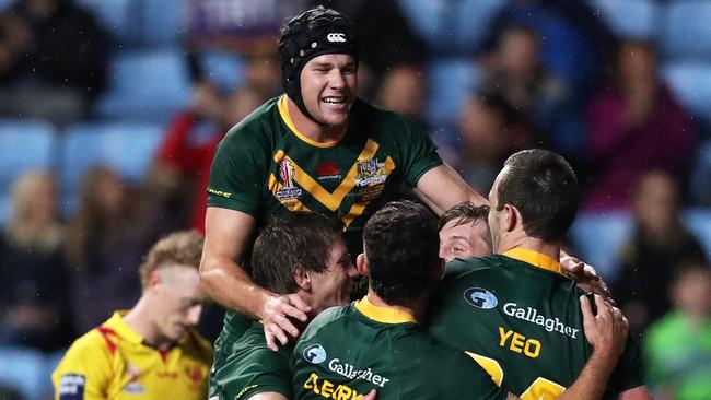 Here Australia celebrate their fourteenth of fifteen tries scored against Scotland. Picture: Getty Images.