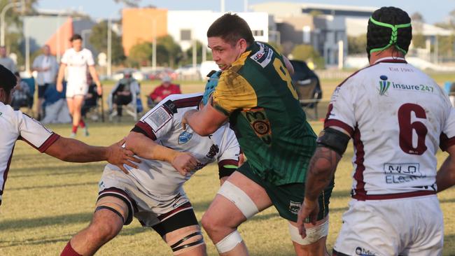 Round 16 Gold Coast District Rugby Union first grade game between Surfers Dolphins and Nerang Bulls. Nerang Player No 20 Mat Monahan Surfers Player No 8 James Brown Pic Mike Batterham