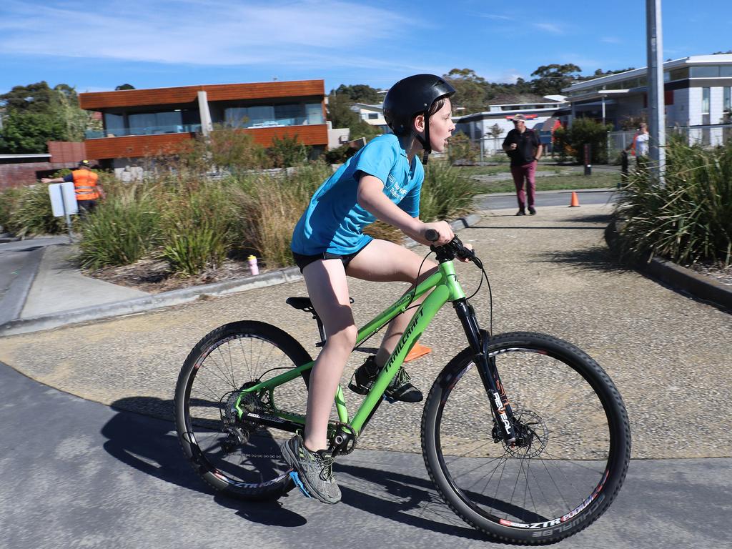 Participants competing in the Bupa KidFit Series triathlon at Blackmans Bay Beach. Picture: LUKE BOWDEN