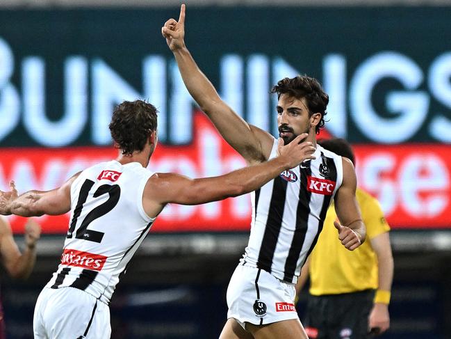 BRISBANE, AUSTRALIA - APRIL 17: Josh Daicos of the Magpies celebrates kicking a goal during the round six AFL match between Brisbane Lions and Collingwood Magpies at The Gabba, on April 17, 2025, in Brisbane, Australia. (Photo by Bradley Kanaris/Getty Images)