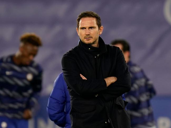 Chelsea's English head coach Frank Lampard looks on as Leicester City's players warm up during the English Premier League football match between Leicester City and Chelsea at the King Power Stadium in Leicester, central England on January 19, 2021. (Photo by Tim Keeton / POOL / AFP) / RESTRICTED TO EDITORIAL USE. No use with unauthorized audio, video, data, fixture lists, club/league logos or 'live' services. Online in-match use limited to 120 images. An additional 40 images may be used in extra time. No video emulation. Social media in-match use limited to 120 images. An additional 40 images may be used in extra time. No use in betting publications, games or single club/league/player publications. /