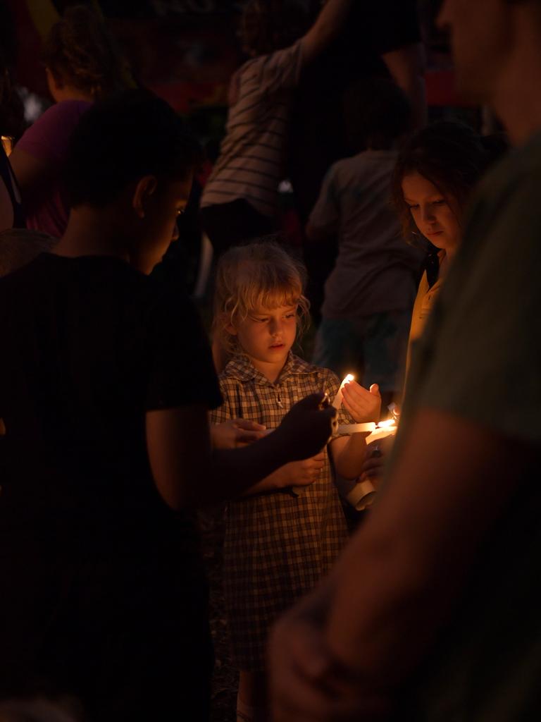 A schoolgirl lights a candle at the #JusticeforCassius vigil. Picture: (A)manda Parkinson