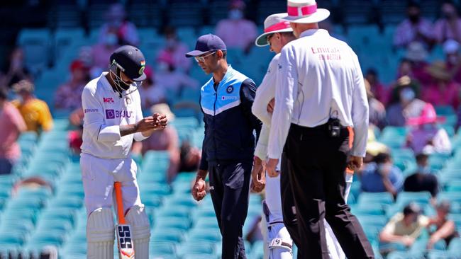 India's Ravindra Jadeja holds his hand after he was hit by the ball. Picture: David Gray/AFP