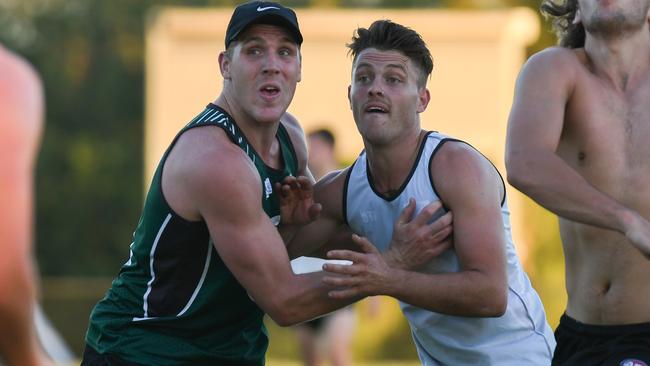 Tom Bell jostles with Ben Fennell at Greensborough training. Picture: Nathan McNeill