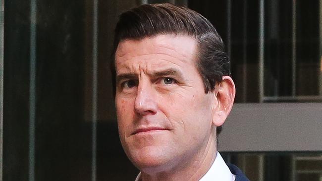 SYDNEY, AUSTRALIA - NewsWire Photos -MARCH 22 2022: Ben Roberts-Smith is seen leaving the Federal Court in Sydney. Mr Roberts-Smith is suing three former Fairfax newspapers over articles he says defamed him in suggesting he committed war crimes in Afghanistan between 2009 and 2012. Picture NCA Newswire/ Gaye Gerard