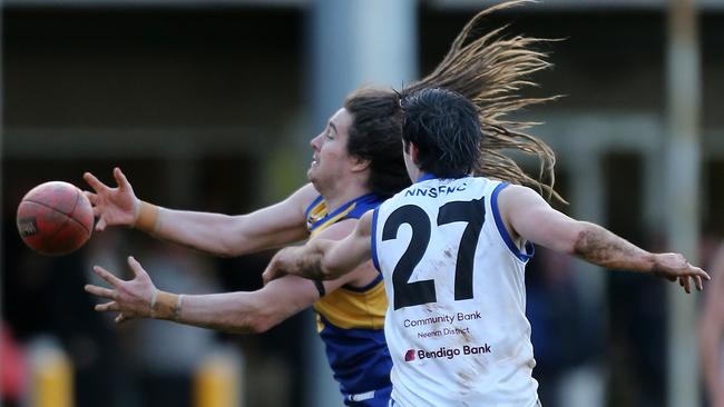 Ellinbank’s Shaun Phelan, left, Neerim South’s Josh White battle for the ball. Picture Yuri Kouzmin