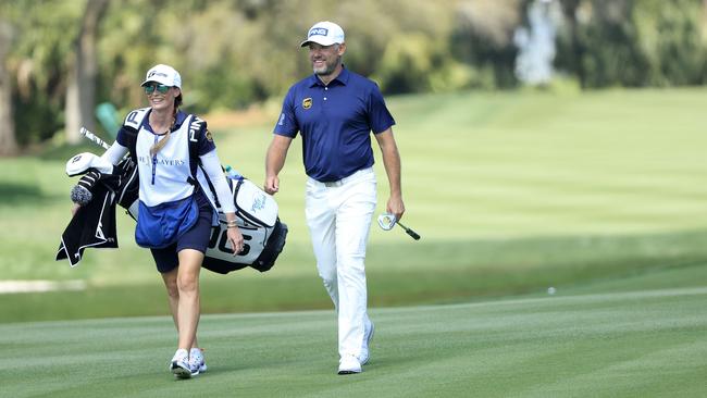 Lee Westwood walks with his caddie and partner Helen Storey on the second hole during the final round of The Players Championship at TPC Sawgrass. Picture: Sam Greenwood/Getty Images/AFP