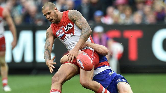 Dale Morris hauls down Lance Franklin, a tackle which led to a Tom Boyd goal.