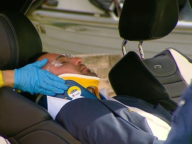 Salim Mehajer is taken to hospital in a neck brace after a car accident which police allege was staged. Picture: Rob Quee.