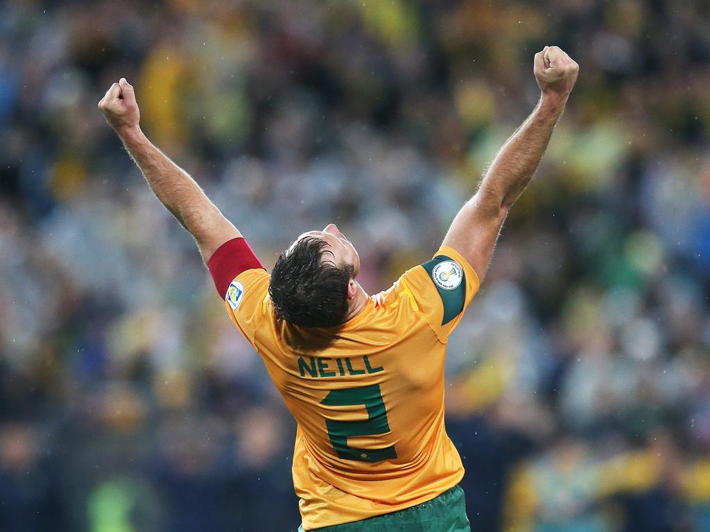 Lucas Neill celebrates a World Cup qualifier victory over Iraq in Sydney, 2013.