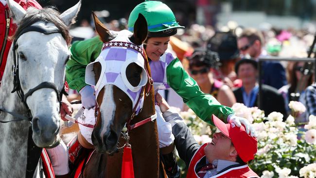 Michelle Payne celebrates with her brother Stevie after winning last year’s Melbourne Cup. Picture: George Salpigtidis