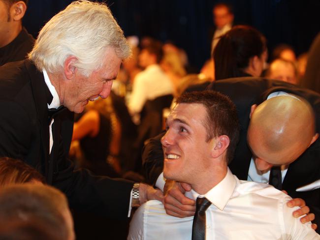 Dane Swan gets congratulated by coach Mick Malthouse after winning the Brownlow.